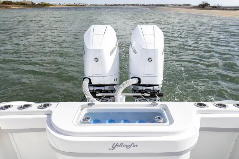 Slide: The Image of 2014 Yellowfin 32 Offshore boat with dual Mercury engines on open water. - 32