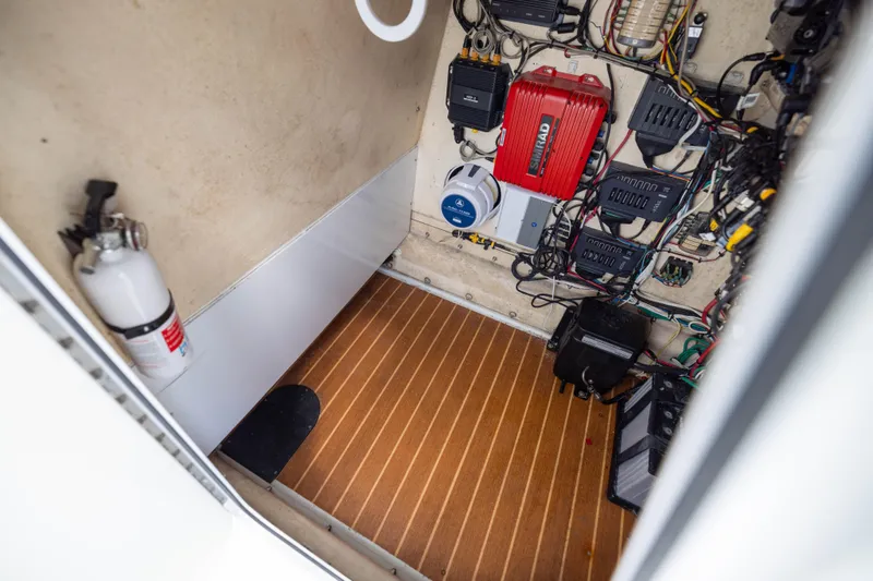 Slide: The Image of Electrical compartment of a 2014 Yellowfin 32 Offshore boat with wiring and equipment. - 33