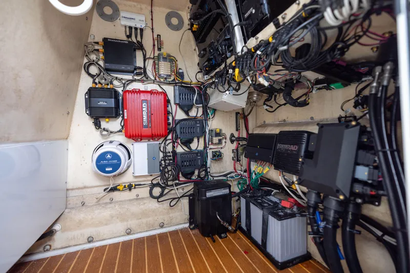 Slide: The Image of Electrical system inside a 2014 Yellowfin 32 Offshore boat, featuring Simrad equipment. - 34