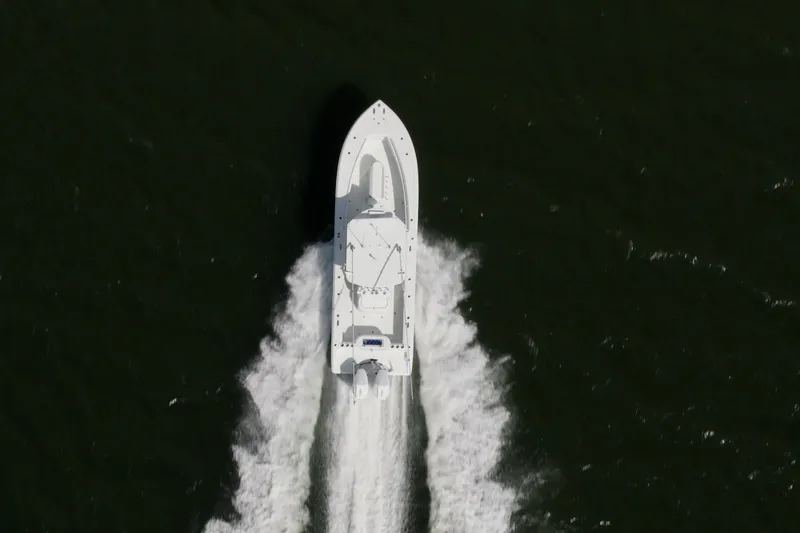 Slide: The Image of Aerial view of 2014 Yellowfin 32 Offshore boat speeding on water. - 6