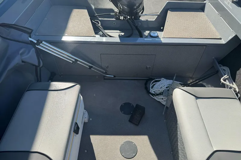 Slide: The Image of Interior of a 2019 KingFisher 1625 Falcon boat with seating and storage. - 14