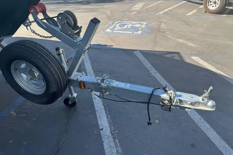 Slide: The Image of Trailer hitch of a 2019 KingFisher 1625 Falcon boat in a parking lot. - 4