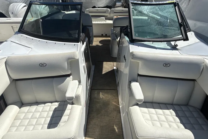 Slide: The Image of 2020 Cobalt R30 boat interior with white leather seating and dual windshields. - 11