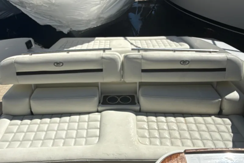 Slide: The Image of Luxury seating on a 2020 Cobalt R30 boat, featuring quilted upholstery and cup holders. - 17