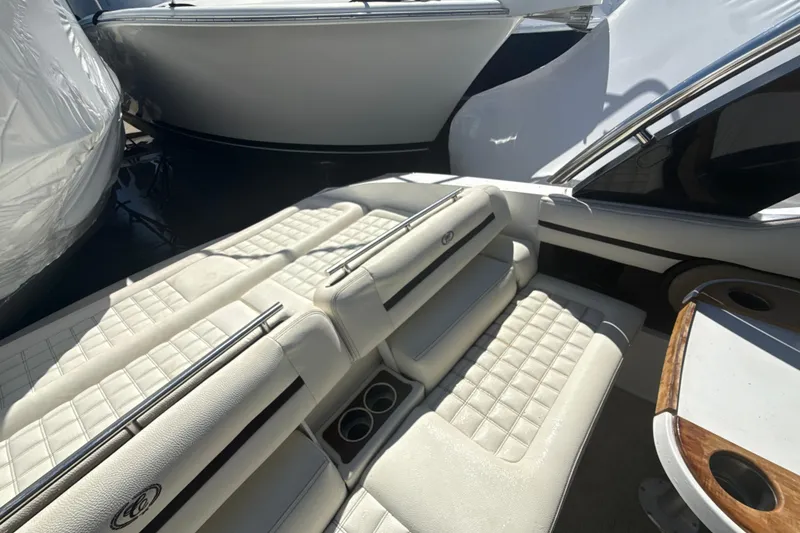 Slide: The Image of Luxurious seating on a 2020 Cobalt R30 boat, featuring elegant white upholstery. - 21