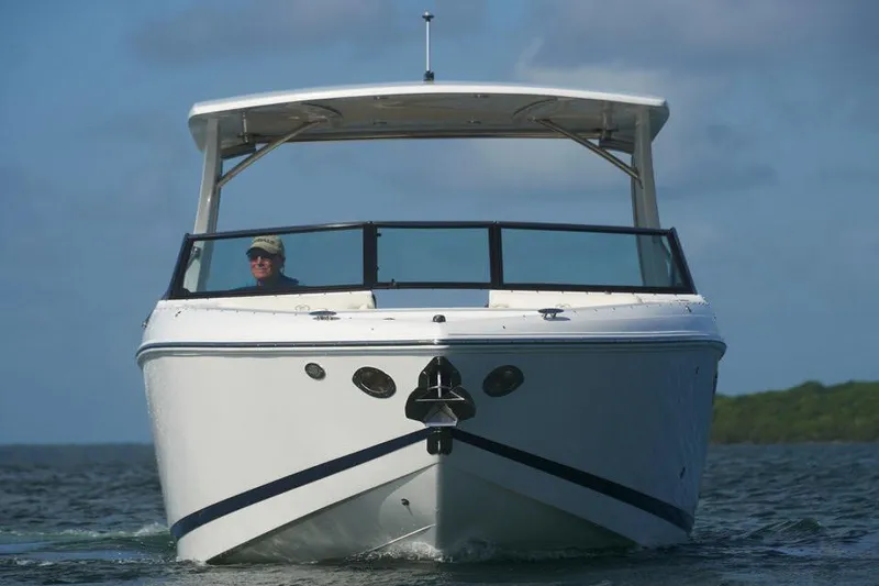 Slide: The Image of Manufacturer Provided Image: Front view of a 2020 Cobalt R30 boat cruising on water. - 3