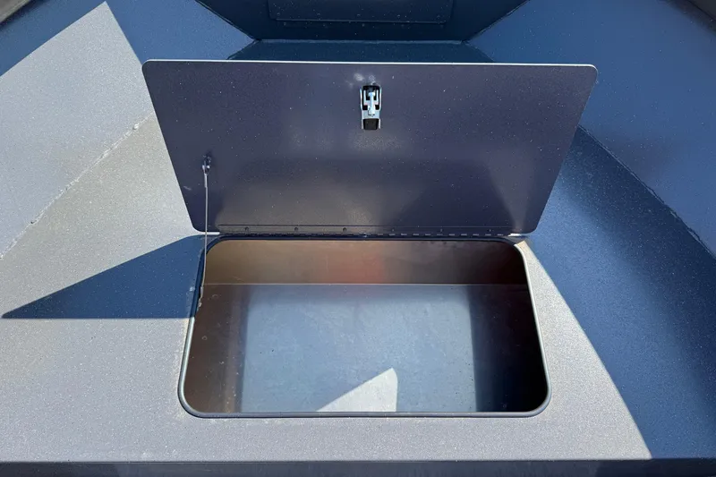 Slide: The Image of Open storage compartment on 2025 Alumaweld Adventurer 22 boat. - 10