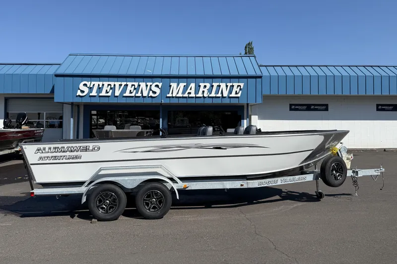 Slide: The Image of 2025 Alumaweld Adventurer 22 boat on trailer at Stevens Marine dealership. - 15
