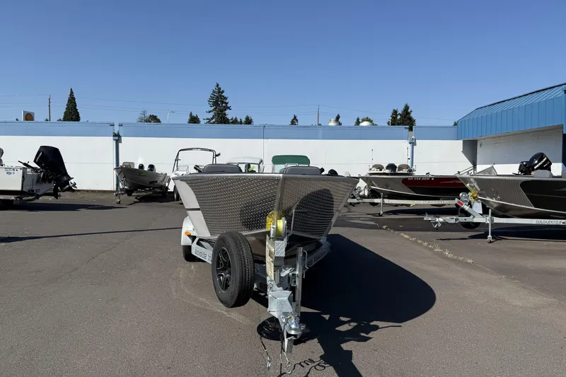 Slide: The Image of 2025 Alumaweld Adventurer 22 boat on trailer in outdoor dealership lot. - 16