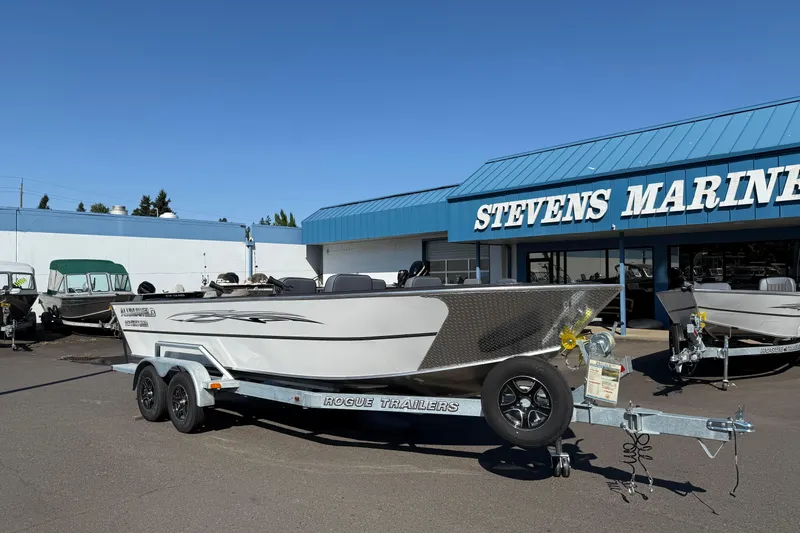 Slide: The Image of 2025 Alumaweld Adventurer 22 boat on trailer at Stevens Marine dealership. - 4