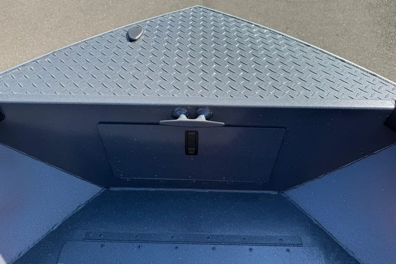 Slide: The Image of 2025 Alumaweld Adventurer 22 boat interior with diamond plate flooring. - 7