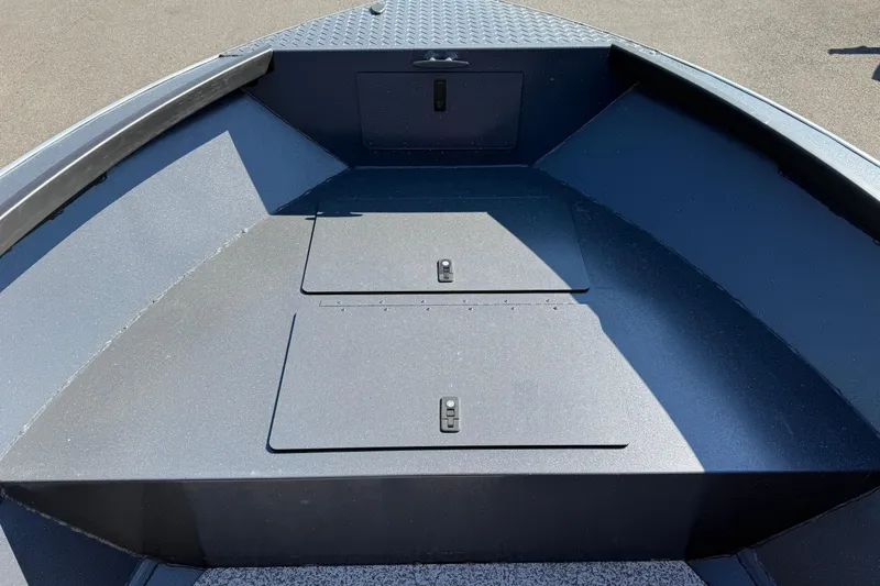 Slide: The Image of 2025 Alumaweld Adventurer 22 boat interior with storage compartments, sleek design. - 9