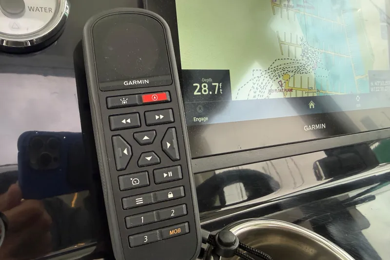 Slide: The Image of Garmin marine navigation system on 2023 Jeanneau NC 1095 boat dashboard. - 18