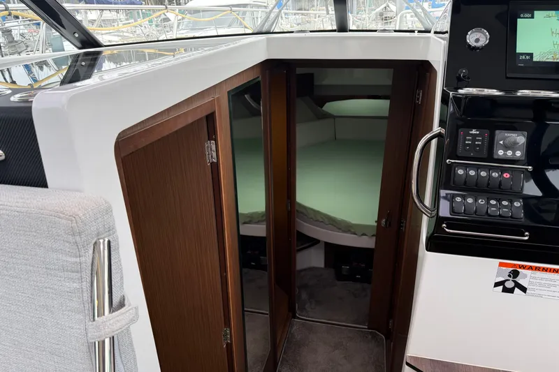 Slide: The Image of Interior cabin view of 2023 Jeanneau NC 1095 boat with control panel. - 21