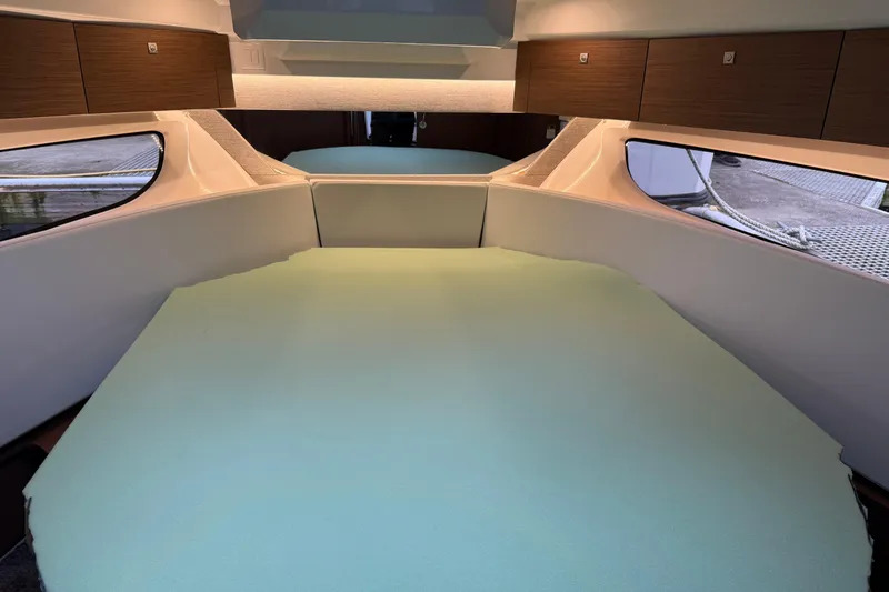 Slide: The Image of Interior cabin of 2023 Jeanneau NC 1095 boat with spacious bed and storage. - 24