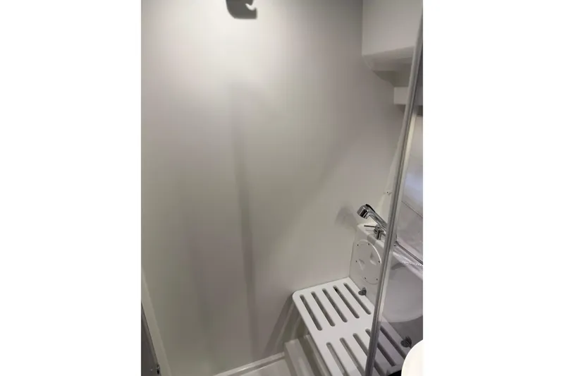 Slide: The Image of Bathroom interior of 2023 Jeanneau NC 1095 boat, featuring modern fixtures and sleek design. - 26