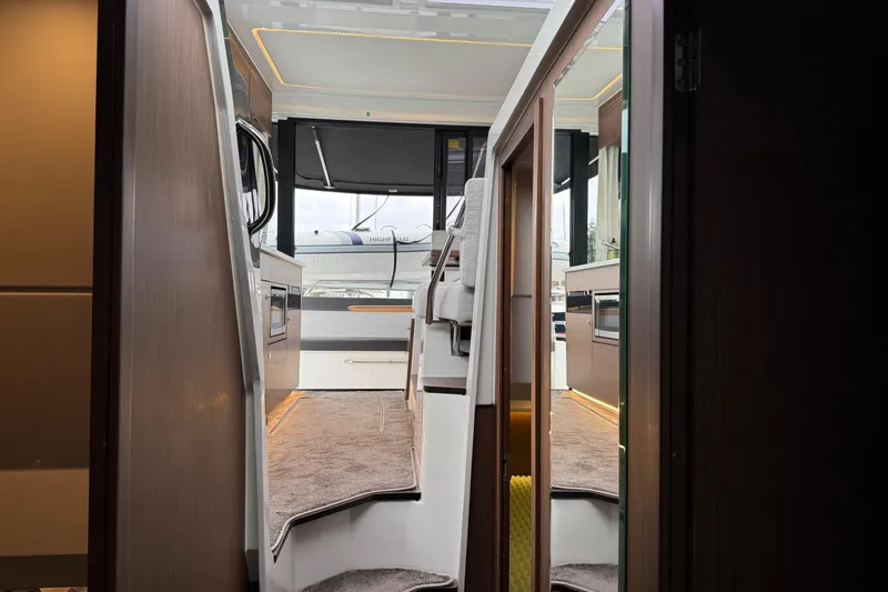 Slide: The Image of Interior view of 2023 Jeanneau NC 1095 yacht, showcasing modern design and luxurious finishes. - 28