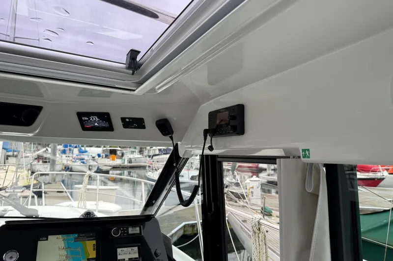 Slide: The Image of Interior view of 2023 Jeanneau NC 1095 boat cockpit with navigation equipment. - 32