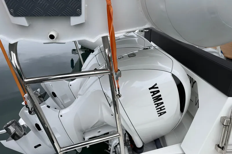 Slide: The Image of 2023 Jeanneau NC 1095 boat with Yamaha outboard motor, featuring a sleek design. - 36