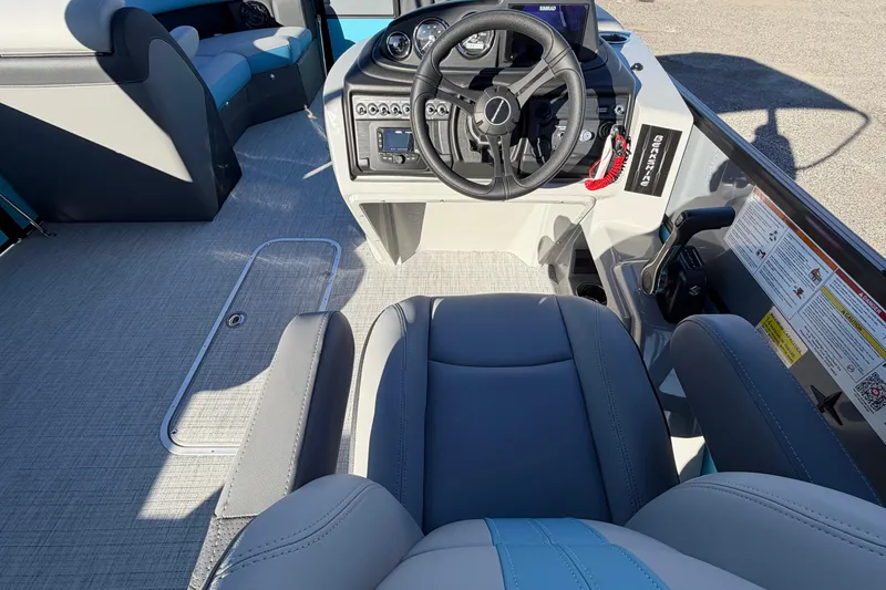 Slide: The Image of Interior view of 2026 Berkshire CTS Series 24UL boat, featuring steering wheel and seating. - 14