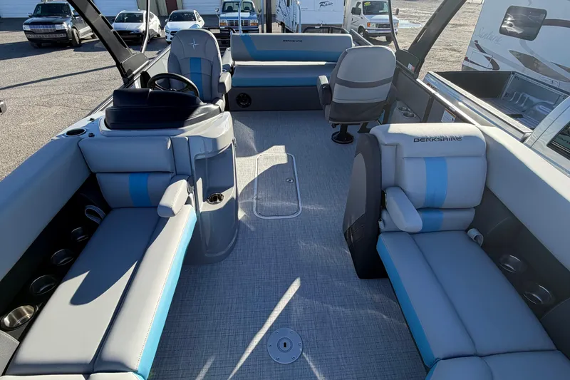 Slide: The Image of Interior of a 2026 Berkshire CTS Series 24UL pontoon boat with modern seating. - 15