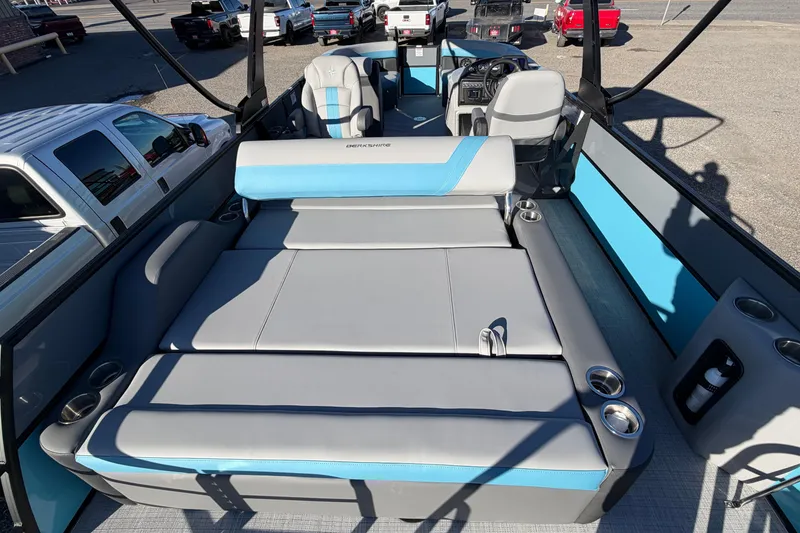 Slide: The Image of 2026 Berkshire CTS Series 24UL pontoon boat interior with spacious seating and cup holders. - 22