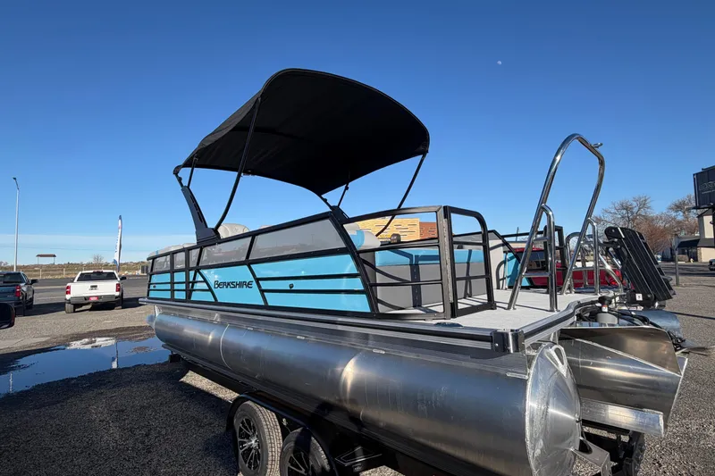 Slide: The Image of 2026 Berkshire CTS Series 24UL pontoon boat with canopy, parked outdoors. - 25