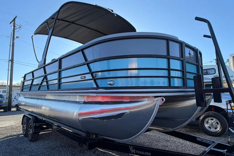 Slide: The Image of 2026 Berkshire CTS Series 24UL pontoon boat on trailer, featuring sleek design and canopy. - 4