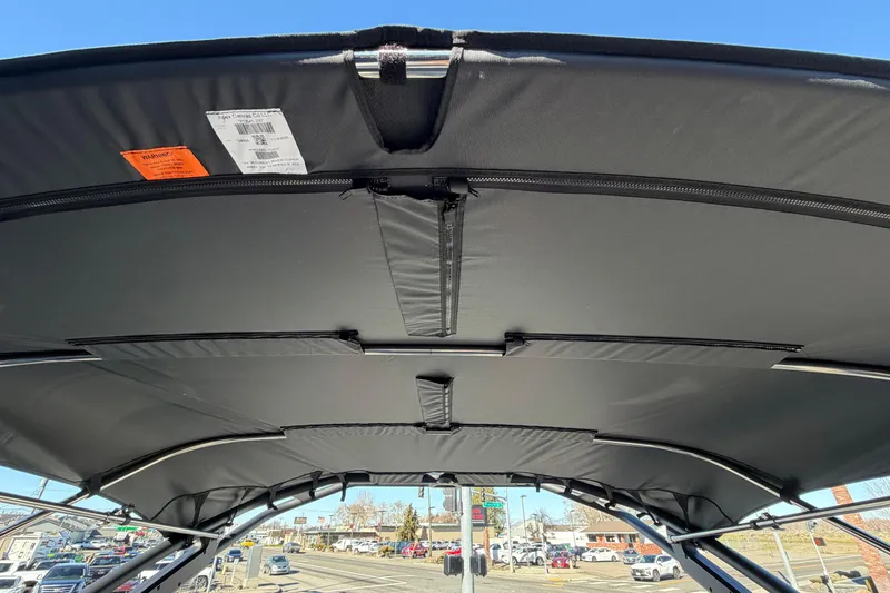 Slide: The Image of Bimini top of 2026 Berkshire CTS Series 24UL boat, showcasing sturdy frame and fabric. - 53