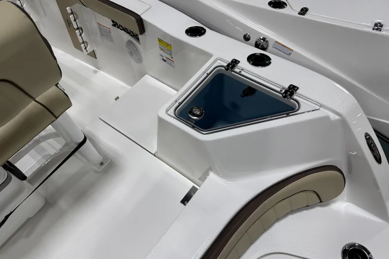 Slide: The Image of 2026 Yamaha Boats 222 FSH Sport interior with seating and storage compartments. - 2