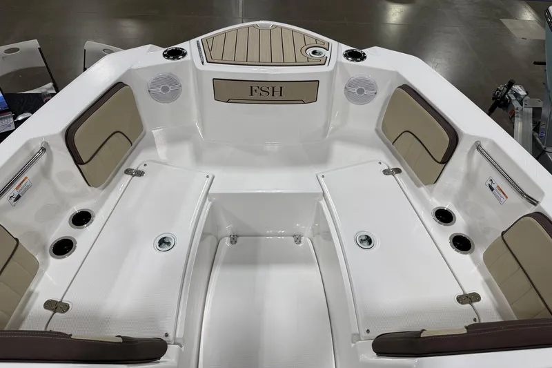 Slide: The Image of 2026 Yamaha Boats 222 FSH Sport interior with seating and storage compartments. - 4