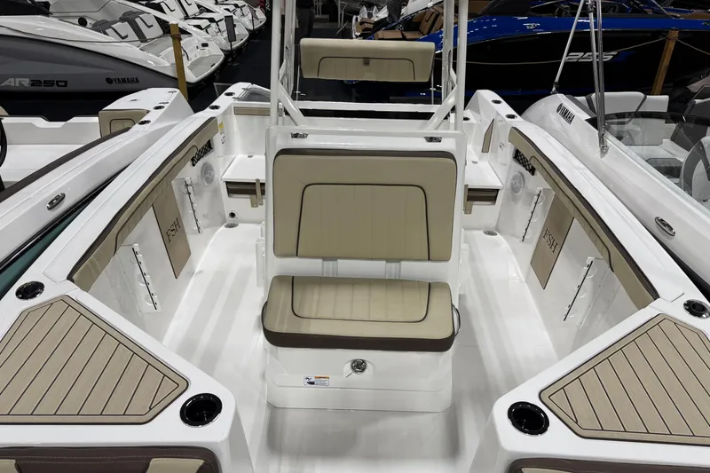 Slide: The Image of 2026 Yamaha Boats 222 FSH Sport interior with beige seating and sleek design. - 5