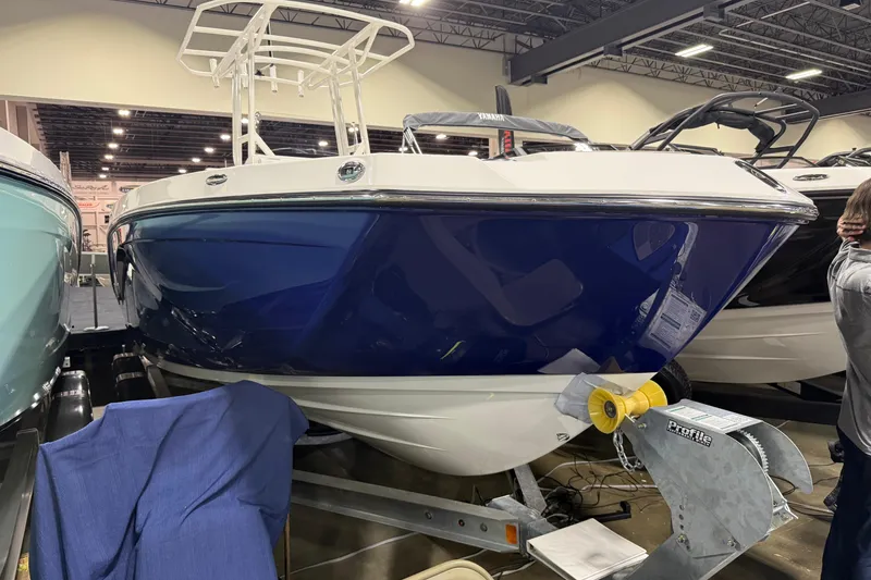 Slide: The Image of 2026 Yamaha Boats 222 FSH Sport displayed indoors on a trailer. - 7