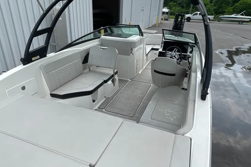Slide: The Image of 2023 Sea Ray SPX 230 boat interior with spacious seating and modern design. - 6