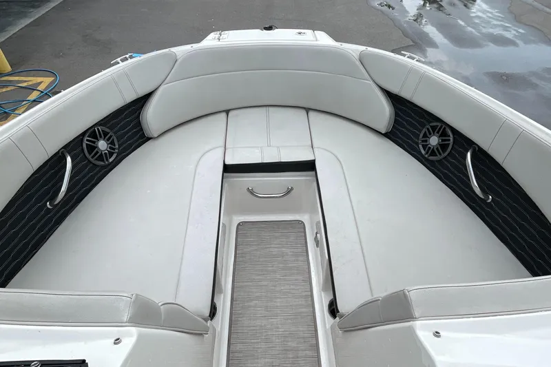 Slide: The Image of 2023 Sea Ray SPX 230 boat interior with white seating and black accents. - 7