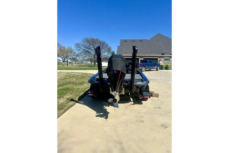 Slide: The Image of 2026 Phoenix 921 Elite X boat on trailer in driveway, sunny day. - 3