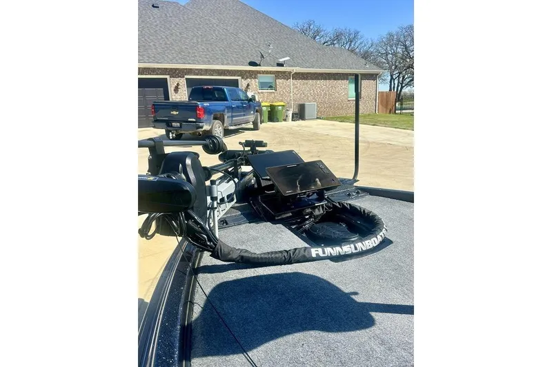 Slide: The Image of 2026 Phoenix 921 Elite X boat with advanced fishing equipment on deck. - 7