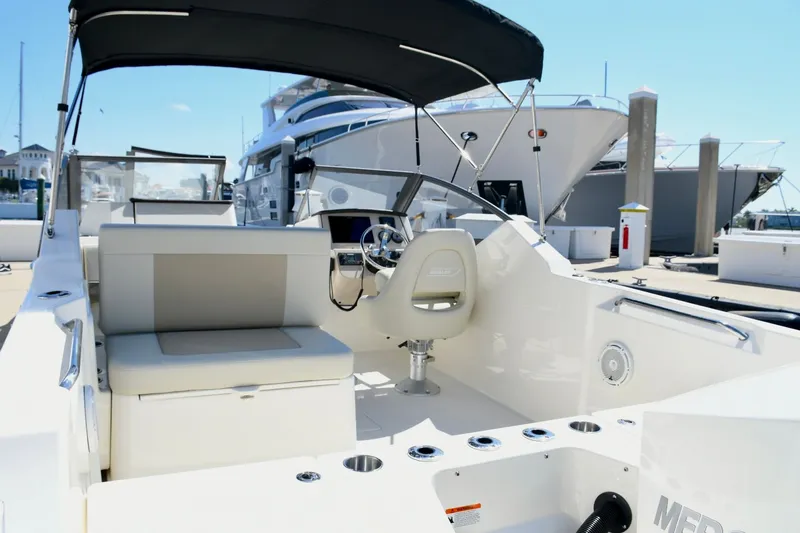 Slide: The Image of Interior view of 2024 Boston Whaler 210 Vantage at dock. - 10