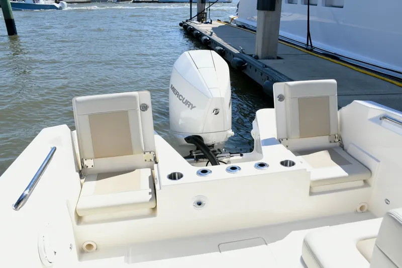 Slide: The Image of Boston Whaler 210 Vantage 2024 with Mercury engine at dock. - 12