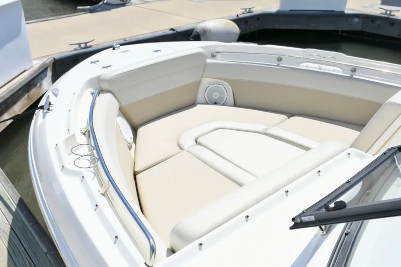 Slide: The Image of Boston Whaler 210 Vantage 2024, luxurious bow seating at dock. - 14