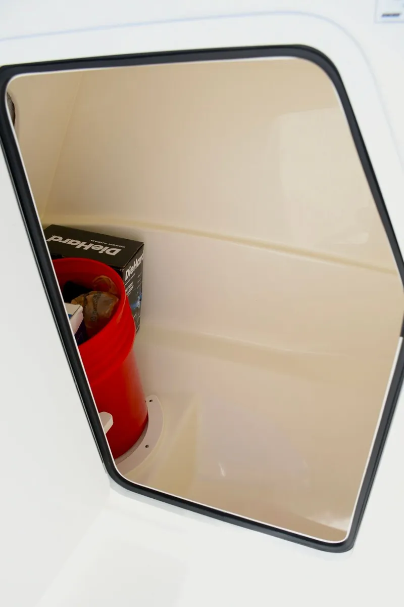 Slide: The Image of Storage compartment in 2024 Boston Whaler 210 Vantage boat. - 18