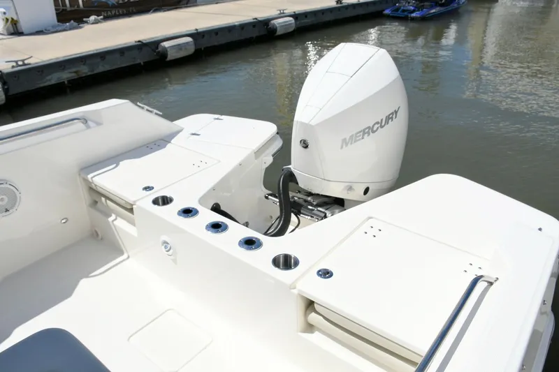 Slide: The Image of Boston Whaler 210 Vantage 2024 with Mercury outboard motor at dock. - 20