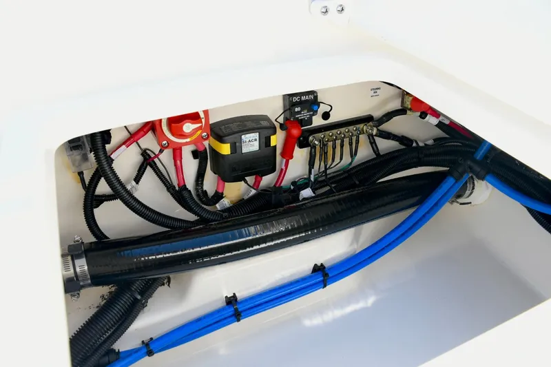 Slide: The Image of 2024 Boston Whaler 210 Vantage electrical system with cables and connections. - 23