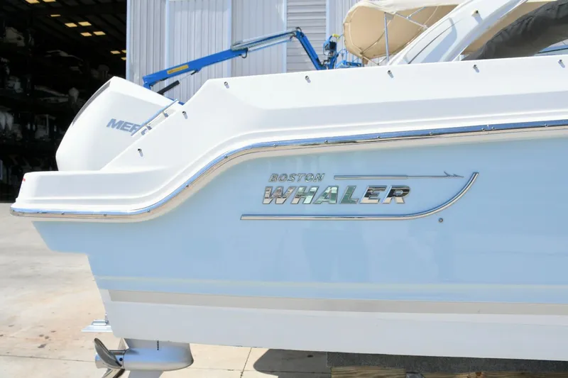 Slide: The Image of 2024 Boston Whaler 210 Vantage boat at dock. - 26