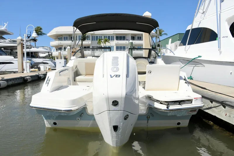 Slide: The Image of 2024 Boston Whaler 210 Vantage boat at dock. - 4