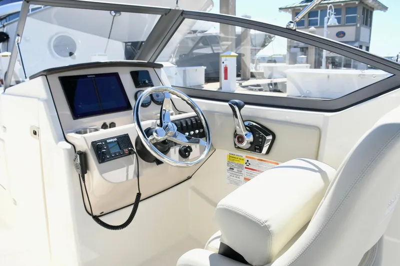 Slide: The Image of Interior view of 2024 Boston Whaler 210 Vantage helm. - 7