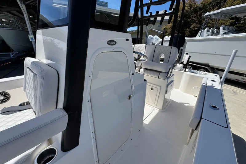 Slide: The Image of 2026 Sea Born FX25 Bay boat interior with sleek seating and modern console design. - 23