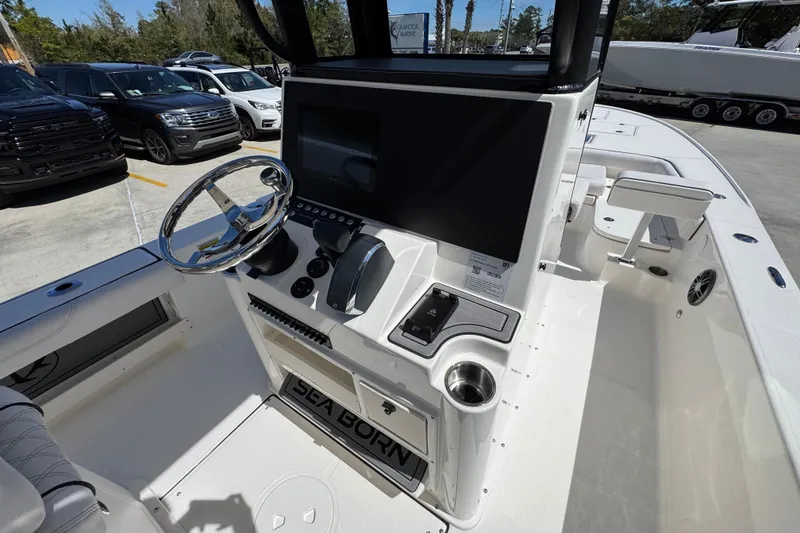 Slide: The Image of 2026 Sea Born FX25 Bay boat cockpit with steering wheel and control panel. - 34