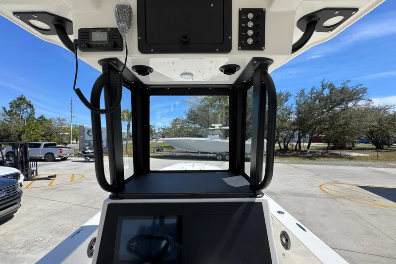 Slide: The Image of 2026 Sea Born FX25 Bay boat console with modern controls and clear canopy. - 35