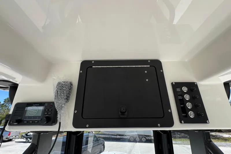 Slide: The Image of 2026 Sea Born FX25 Bay boat dashboard with Garmin device and control panel. - 36